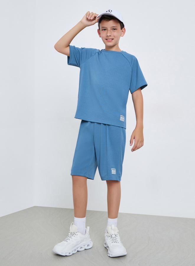 ستايلي مجموعة من شورت وتيشيرت محبوك بتفاصيل بارزة - Image 1